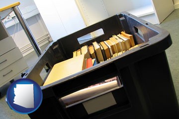 a moving box in an empty office, during a relocation project - with Arizona icon