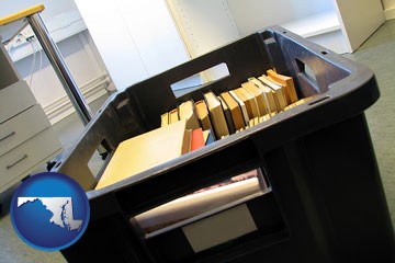 a moving box in an empty office, during a relocation project - with Maryland icon