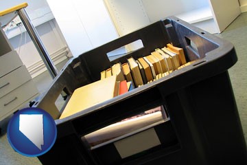 a moving box in an empty office, during a relocation project - with Nevada icon